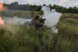 A Ukrainian service member of the 128th Separate Territorial Defence Brigade attends military exercises at a training ground, amid Russia's attack on Ukraine, in Dnipropetrovsk region, Ukraine [File: Viacheslav Ratynskyi/Reuters]