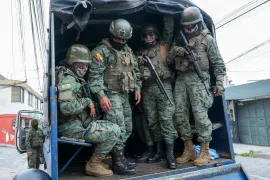 Soldiers patrol the perimeter of Inca prison during a state of emergency in Quito, Ecuador, in the wake of the apparent escape of a powerful gang leader from prison [Dolores Ochoa/AP]