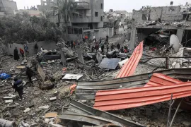 At least 90 Palestinians were killed in Sunday's attack on the Maghazi refugee camp [Abdelhakim Abu Riash/Al Jazeera]