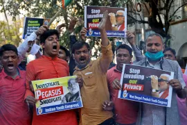 State-sponsored surveillance through Pegasus is not a new threat for Indian activists, journalists and politicians. This image from February 2022 shows a protest in Kolkata against Modi by supporters of India's main opposition Congress party [Rupak De Chowdhuri/AP]