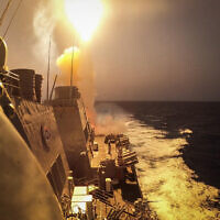 Illustrative: This handout picture courtesy of the US Navy taken on October 19, 2023, shows the Arleigh Burke-class guided-missile destroyer USS Carney (DDG 64) defeating a combination of Houthi missiles and unmanned aerial vehicles in the Red Sea. (Aaron Lau / US NAVY / AFP)