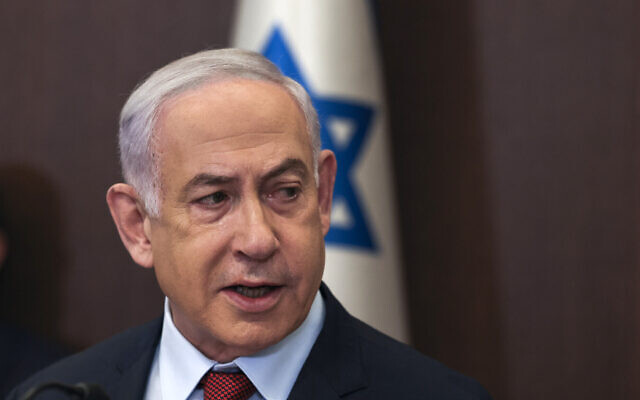 Prime Minister Benjamin Netanyahu heads the weekly cabinet meeting at his office in Jerusalem on December 10, 2023. (Ronen Zvulun/Pool/AFP)