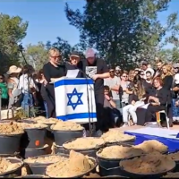 Iris, Raviv and Tuval Haim, at the funeral of Yotam Haim, a hostage mistakenly killed by the IDF in Gaza, in Kibbutz Gvulot, December 18, 2023. (Screenshot used in accordance with clause 27a of the copyright law)