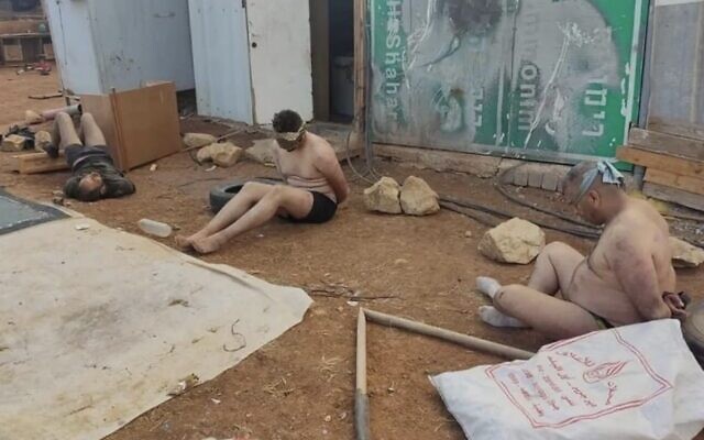 A photo of Palestinians bound and stripped after being apprehended by IDF soldiers and settlers in the central West Bank village of Wadi al-Seeq on October 12, 2023. (Used in accordance with clause 27a of the Copyright Law) A photo of Palestinians bound and stripped after being apprehended by IDF soldiers and settlers in the central West Bank village of Wadi al-Seeq on October 12, 2023. (Used in accordance with clause 27a of the Copyright Law)