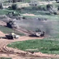Israeli armored vehicles of the 36th Division roll into central Gaza, in a handout video published December 26, 2023. (Israel Defense Forces)