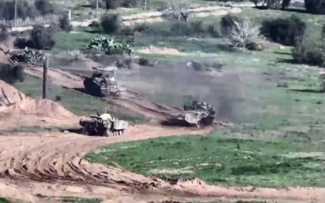 Israeli armored vehicles of the 36th Division roll into central Gaza, in a handout video published December 26, 2023. (Israel Defense Forces)
