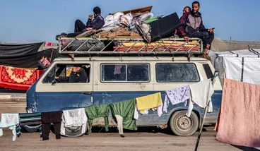 Palestinians who fled the central Gaza Strip reach Rafah, on Tuesday.
