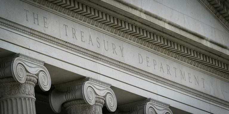 The Treasury Building is viewed in Washington, May 4, 2021. The U.S. government has imposed sanctions on a Bosnian state prosecutor who is accused of being complicit in corruption and undermining democratic processes or institutions in the Western Balkans. The Treasury Department says its Office of Foreign Assets Control designated Diana Kajmakovic for sanctions. (AP Photo/Patrick Semansky, File)