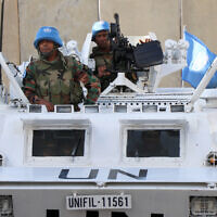 Illustrative - Peacekeepers of the United Nations Interim Force in Lebanon (UNIFIL) man their armored vehicle in Lebanon's southern town of Naqoura near the border with Israel, on October 15, 2023. (AFP)