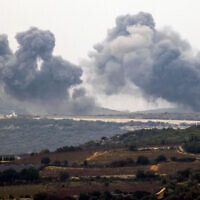 Smoke billows in the southern Lebanese village of Marwahin following an Israeli airstrike, December 27, 2023. (Jalaa Marey/AFP)