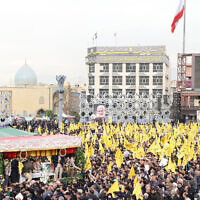 Mourners attend the funeral of Razi Mousavi, a senior commander in the Quds Force of Iran's Islamic Revolutionary Guard Corps (IRGC) who was killed on December 25 in an alleged Israeli strike in Syria, in Tehran, on December 28, 2023. (Photo by ATTA KENARE / AFP)