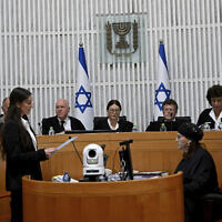 Supreme Court President Esther Hayut and all 14 other judges hear petitions against the 'reasonableness law' at the court in Jerusalem on September 12, 2023. (DEBBIE HILL / POOL / AFP)