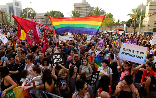 Hundreds protest in support of the right of LGBTQ couples to adopt children, outside the Ministry of Absorption in Tel Aviv on July 20, 2017. (Tomer Neuberg/Flash90)