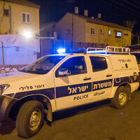 Illustrative: A police vehicle at a crime scene in Netanya, October 14, 2018. (Flash90)