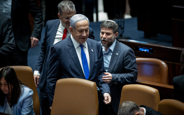 Prime Minister Benjamin Netanyahu (left) and Finance Minister Bezalel Smotrich attend a vote on the 'reasonableness' bill at the Knesset, in Jerusalem, on July 24, 2023. (Yonatan Sindel/Flash90)