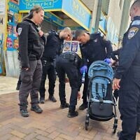 Police at the scene where a 2-year-old boy was stabbed to death in Lod, December 28, 2023. (Israel Police)