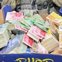 Israeli forces seized around NIS 10 million from nine money exchange branches in the West Bank overnight during a raid on companies found to be transferring funds to Hamas and the Palestinian Islamic Jihad, December 28, 2023. (Israel Defense Forces)