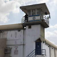 A prison guard stands at Gilboa prison in northern Israel, on September 6, 2021. (AP Photo/Sebastian Scheiner)