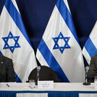 War cabinet minister Benny Gantz (right) with Prime Minister Benjamin Netanyahu during a press conference at the Defense Ministry, in Tel Aviv. December 16, 2023. (Noam Revkin Fenton/Flash90)