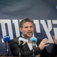 Finance minister and head of the Religious Zionist party, Bezalel Smotrich leads a faction meeting at the Knesset in Jerusalem, December 18, 2023. (Chaim Goldberg/ Flash90)