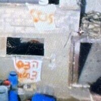 This photo released by the Israel Defense Forces on December 17, 2023, shows signs reading 'SOS' and 'Help, 3 hostages,' that were put up in Gaza by three Israeli hostages who were later mistakenly killed by IDF troops. (Israel Defense Forces)