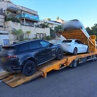 Vehicles seized as part of a police raid on a beverage company owner suspected of fraud. (Israel Police spokesperson)