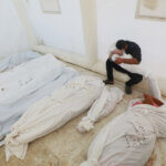 Palestinians mourn as they collect the bodies of loved ones killed in Israeli airstrikes on December 18, 2023, at Al-Aqsa hospital in Deir El-Balah, Gaza Strip. (Photo: Omar Ashtawy/APA Images)