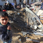 Palestinians inspect the damage to a residential buildings belonging following Israeli bombardment on Deir El-Balah in the central Gaza Strip, on December 22, 2023. (Photo: Omar Ashtawy/APA Images)