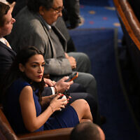 US Rep. Alexandria Ocasio-Cortez sits in the US House of Representatives at the US Capitol in Washington, DC, January 3, 2023. (Mandel Ngan/AFP)
