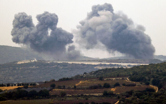 Smoke billows in the southern Lebanese village of Marwahin following an Israeli airstrike, December 27, 2023. (Jalaa Marey/AFP)