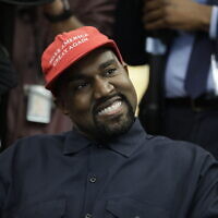 Rapper Kanye West wears a Make America Great Again hat during a meeting with then-US president Donald Trump in the Oval Office of the White House in Washington on October 11, 2018. (AP Photo/Evan Vucci, File)