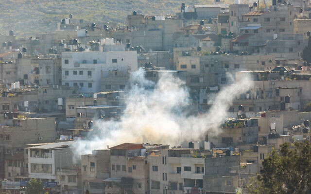 Smoke rises during an Israeli military raid in Tulkarem, in the West Bank, December 17, 2023. (Nasser Ishtayeh/Flash90)