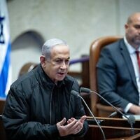 Prime Minister Benjamin Netanyahu speaks before the Knesset on December 25, 2023. (Yonatan Sindel/Flash90)