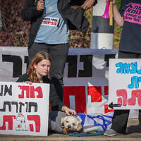 Northern residents and their supporters call for better care from the state, in a protest at Amiad junction, northern Israel, December 26, 2023. (David Cohen/Flash90)