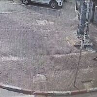 Screen capture from video of an assailant, bottom right, stabbing a pregnant woman in Lod, November 30, 2023. (X. Used in accordance with Clause 27a of the Copyright Law)