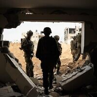 IDF troops seen operating in the Gaza Strip in this handout photo released December 23, 2023. (Israel Defense Forces)