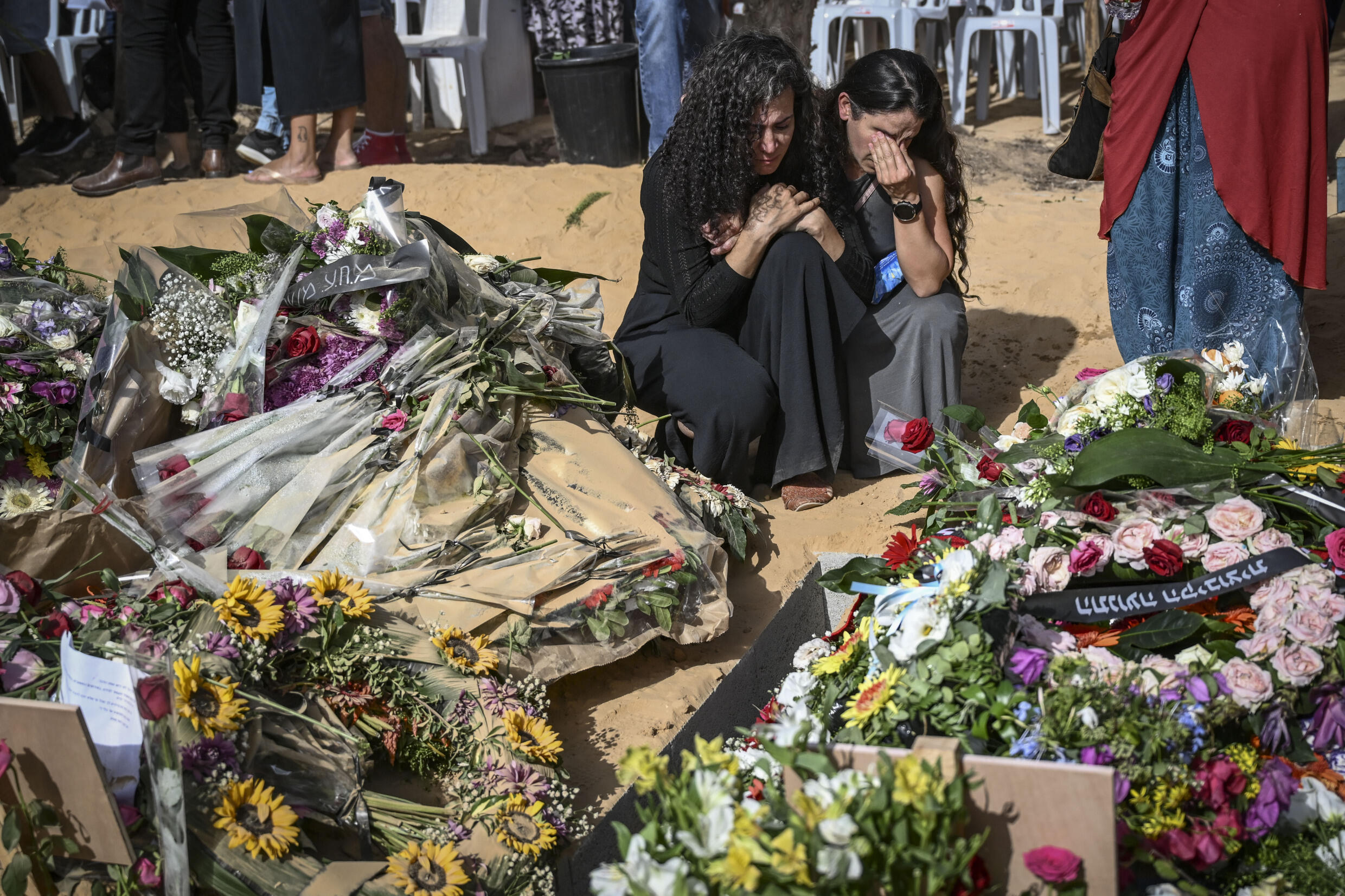 Relatives mourn at Kibbutz Beeri