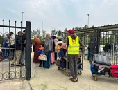 Palestinians enter the Rafah Crossing, on December 5. 